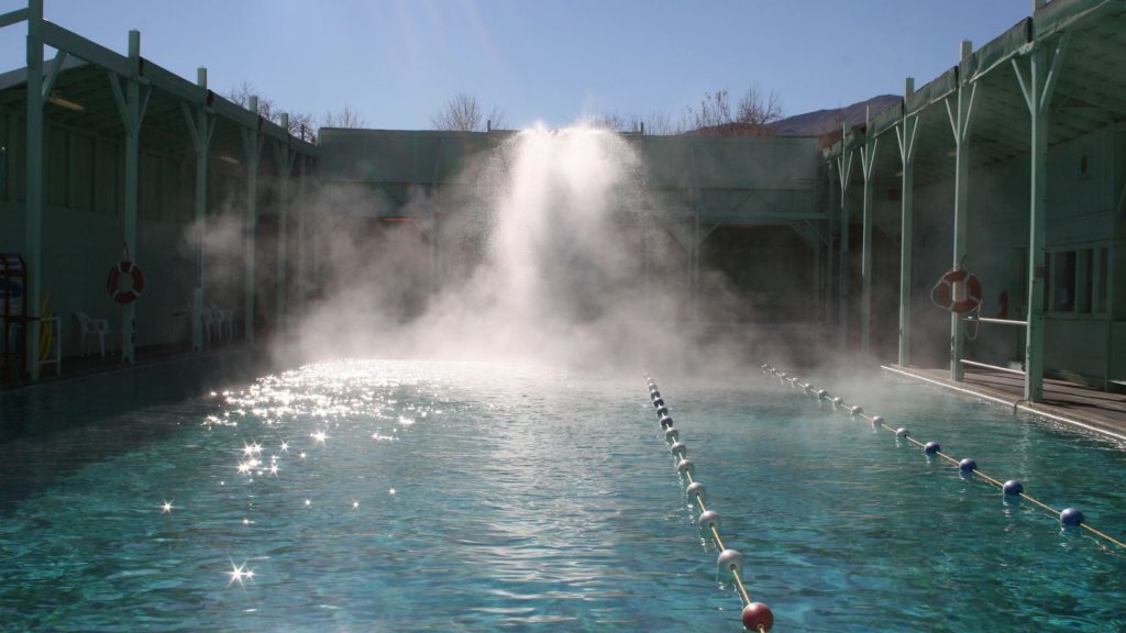 Steam rising over the large managed mineral pool at Keough's Hot Springs near Bishop